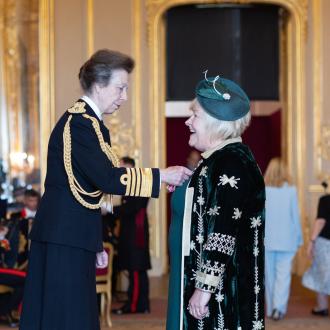 Julie Hawker receives MBE from Princess Anne
